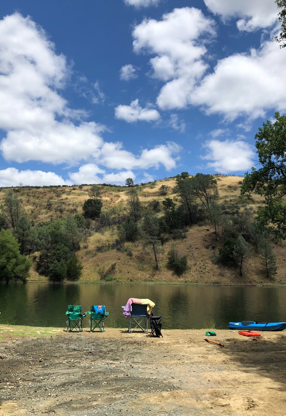 Lakeside chairs and a kayak at an LBEPOA campground